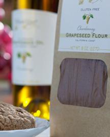 A bag of grapeseed flour and fresh baked cookies